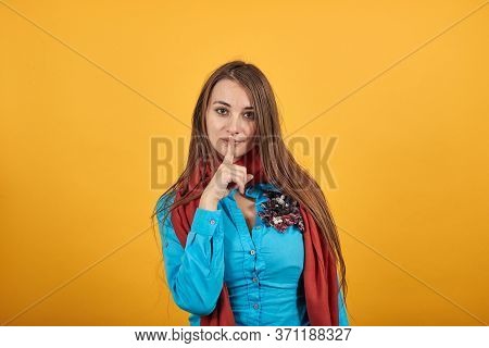 Index Finger On Lips, Silence Gesture, Shhh Quiet, Asks For Voicelessness Forefinger At The Mouth. Y