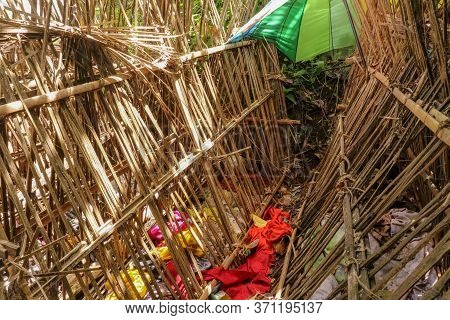 Grave Of Bamboo Sticks In Cemetery In Terunyan Village. Traditional Kuburan In Bali, Indonesia. Bodi