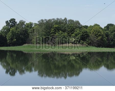Forest Reflected In Waters Of Artificial Breeding Pond In European Goczalkowice Town At Silesian Dis