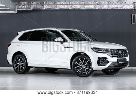Novosibirsk/ Russia - March 15, 2020: White Volkswagen Touareg, Expensive Crossover  Car Parked On B