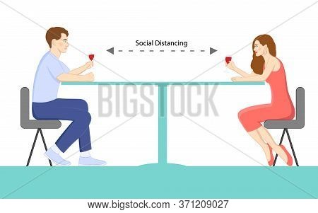A Couple On A Date Enjoying Their Wine Maintaining Social Distancing For Protection Against Covid-19