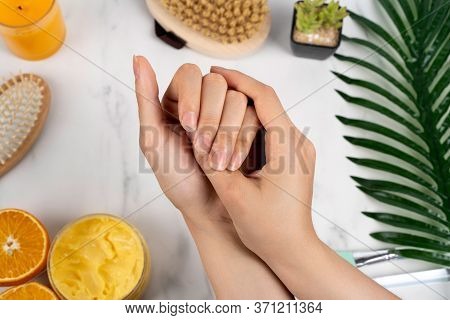 Natural Manicure Girls Hands On The Background Of Marble And Bathroom
