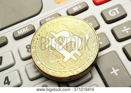 Close Up Image Of Cryptocurrency Bitcoin On Calculator, Bitcoin Concept