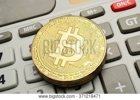 Cryptocurrency Bitcoin On Calculator, Close Up Image, Crypto Concept