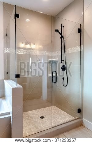 Shower Stall With Half Glass Enclosure And Black Shower Head And Handle
