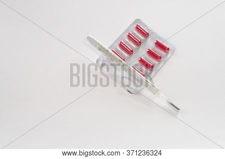 One Mercury Thermometer And Red Pills In Cover