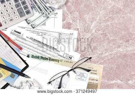 Irs Form 1040nr Nonresident Alien Income Tax Return Lies On Flat Lay Office Table And Ready To Fill.