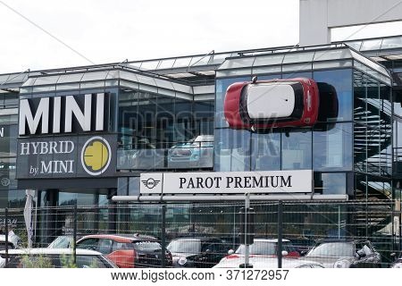 Bordeaux , Aquitaine / France - 10 17 2019 : Mini Red Car Is Fixed Into Building Wall At Bmw Mini Co