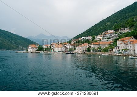 The Coastline Of The City Of Lepetane In Montenegro, Near The Ferry Crossing Through Kotor Bay.
