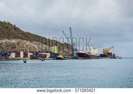 Point Blanche, St. Maarten - May 1, 2019: The Port St. Maarten's Captain David Cargo Quay In Cloudy 
