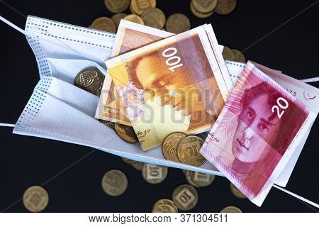 Medical Face Masks And Money Background. World Coronavirus Epidemic And Economic Losses Concept. Con