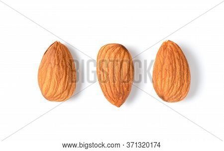 Three Peeled Almonds Isolated On White Background. Almonds Are Very Popular Nuts And High Protein. H