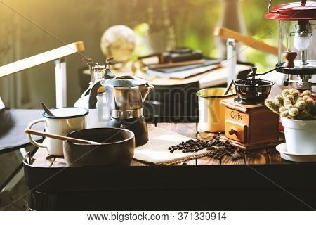 Cup Of Coffee, Beans Roating And Ingredients For Making Coffee  And Accessories On The Table. Coffee