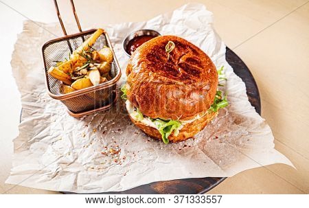 burger with tomato sauce and baked potato