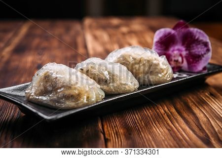 Side View On Korean Patties Starchy Pyan-se Pygody On The Wooden Table, Horizontal