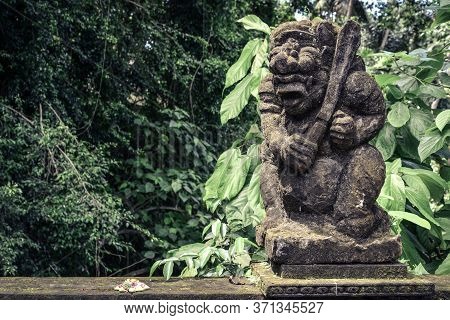 Traditional Balinese Guardian Statue At Entrance Of Pura Gunung Lebah Temple In Ubud, Bali Island, I