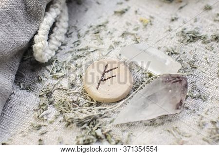 Scandinavian Wooden Rune Fehu, Fe, Feoh On A Rough Linen Cloth With Amethyst Crystalline, Rock Cryst