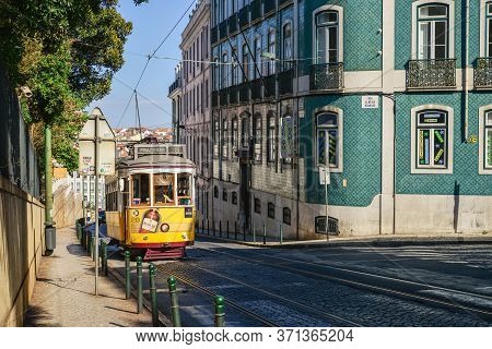Lisbon, Portugal - July 4, 2019: Famous Tram 28 Full Of Tourists In The City Center Of Lisbon - One 