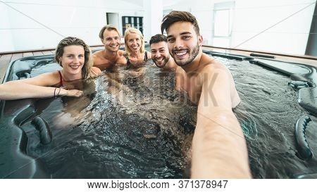 Happy Friends Taking Selfie While Doing Jacuzzi In Luxury House - Young People Having Fun Together I