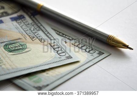 Closeup Baby Tree With Coins On Old Wooden Background. Business Financce And Saving Money Concpt.