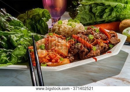Korean Beef Bulgogi Ssambap Lettuce Wraps With Spicy Kimchi And Gochujang Hot Sauce