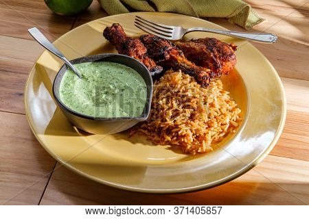 Peruvian Chicken Legs With Aji Verde Green Cilantro Sauce And Fried Rice