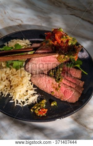 Rib-eye Steak Cooked Rare With Hot And Spicy Thai Crying Tiger Sauce Also Called Suea Rong Hai