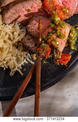 Rib-eye Steak Cooked Rare With Hot And Spicy Thai Crying Tiger Sauce Also Called Suea Rong Hai