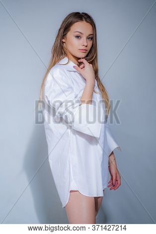 Cheerful Woman With Blonde Hair Wearning Stylish Casual. Portrait Of A Beautiful Girl In Studio