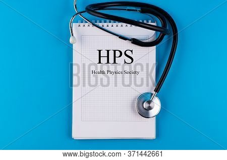Hps Text Written In A Notebook Lying On A Desk And A Stethoscope. Medical Concept.
