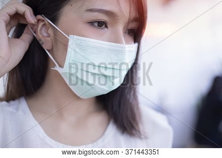 Coronavirus, Woman With Medical Face Mask,women Wearing Masks To Protect From The Corona Virus.
Conc