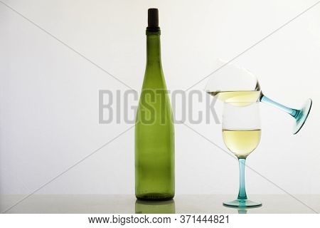 White Wine And Green Glass Bottle