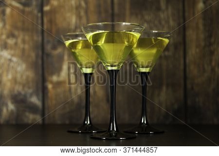 Three Yellow Cocktails Glasses