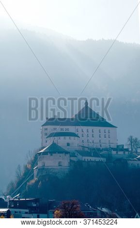 Amazing view Kufstein Fortress on a hillside on a background of blurred mountain lighted soft autumn sunny, Kufstein Austria.