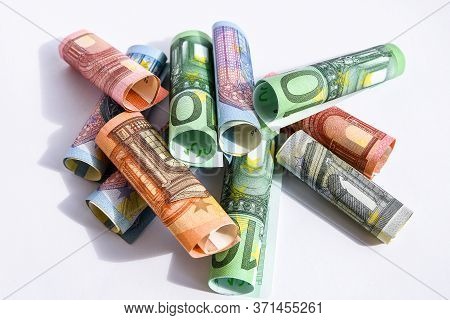Rolled Up Euro Bills, Euro Banknotes Rolled Up On A White Background Several Hundred Euros On White 
