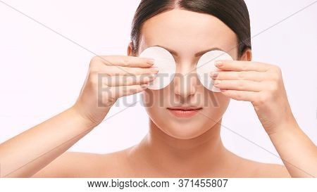 Young Girl Remove Cosmetic From Face. Skin Care With Cotton Pad.