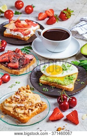 Breakfast Different Toasts With Berries, Cheese, Egg And Fruit, Light Background. Breakfast Table Co