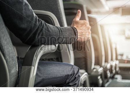 Public Transportation Passenger Showing His Thumb Up. Caucasian Men Seating Inside Intercity Coach B