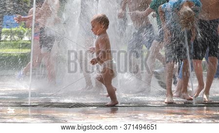 Gomel, Belarus - June 10, 2020: Children Bathe In A Fountain In The Park Gromyko