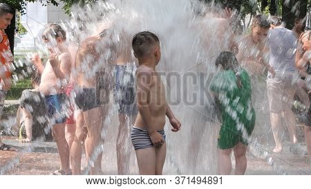 Gomel, Belarus - June 10, 2020: Children Bathe In A Fountain In The Park Gromyko