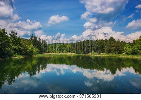 Panoramic View On Mountain Lake And Forest