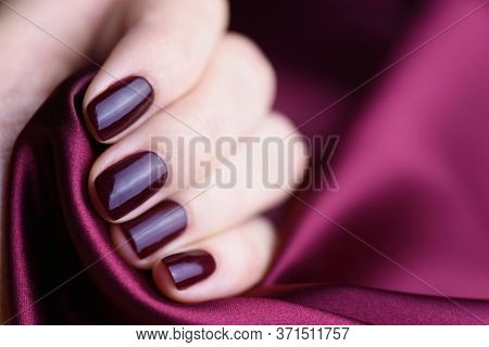 Manicure With Burgundy Color Nails On Burgundy