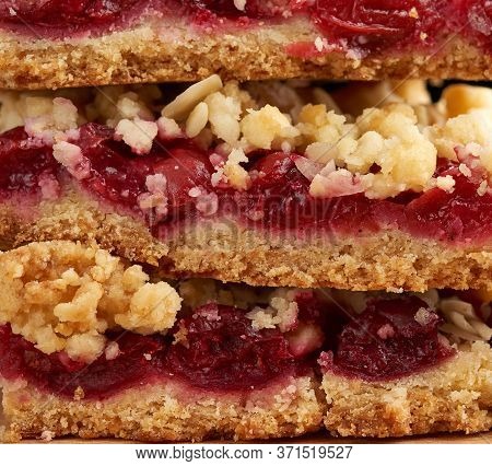 Stack Of Square Baked Slices Of Cramble With Red Cherry, Delicious Pie, Full Frame