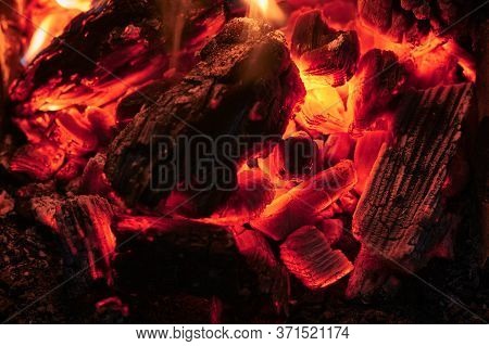 Coals In A Fire Close-up At Night