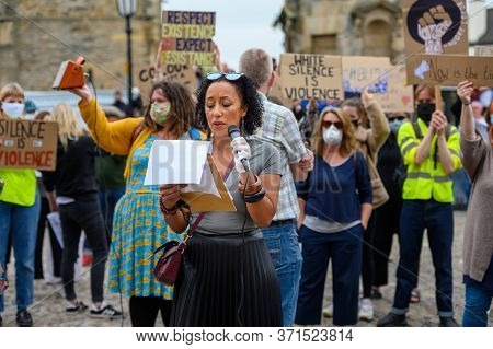 Richmond, North Yorkshire, Uk - June 14, 2020: Protesters Holding Placards Listen To A Female Speake