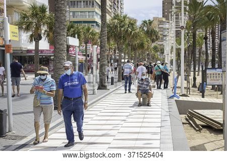 Benidorm, Spain, 14 June, 2020: People Enjoy Sunny Day In Benidorm Levante Beach Promenade. Popular 