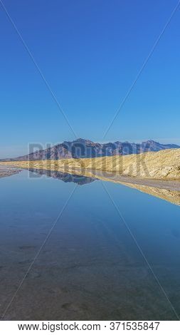 Vertical Crop Reflections In A Pan At The Bonnievale Salt Flats