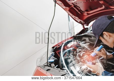Asian Man Mechanic Inspection Shine A Torch Car Engine Checking Bug In Engine From Application Smart