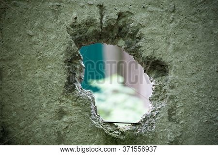 A Hole In A Concrete Wall. Abstract Industrial Background. Light Day