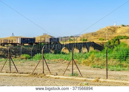 View Of The Ancient Bridge Of Naharayim At Gesher, Across The Jordan River, Between Israel And Jorda